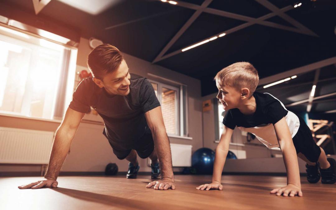 Father and son doing push ups